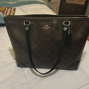 Coach brown bag with handle. No tears and clean on the inside.